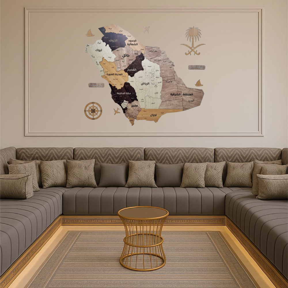 Decorative wall map of Saudi Arabia in a living room with a sectional sofa and coffee table.